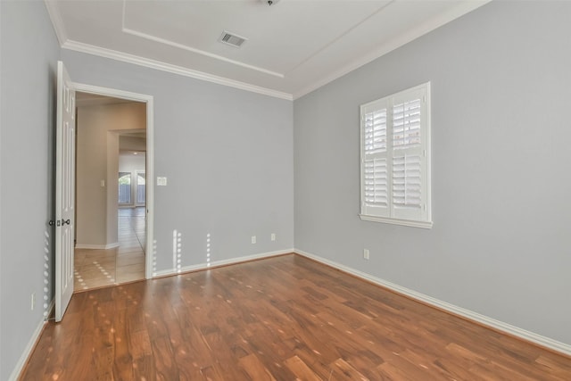 18618 Arlan Lake Dr, Spring, TX 77388 - spare room featuring crown molding, wood finished floors, and baseboards