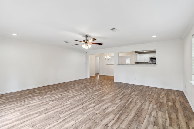 6038 Woodbrook Ln, Houston, TX 77008 - unfurnished living room with a chandelier, light wood finished floors, a ceiling fan, crown molding, and baseboards
