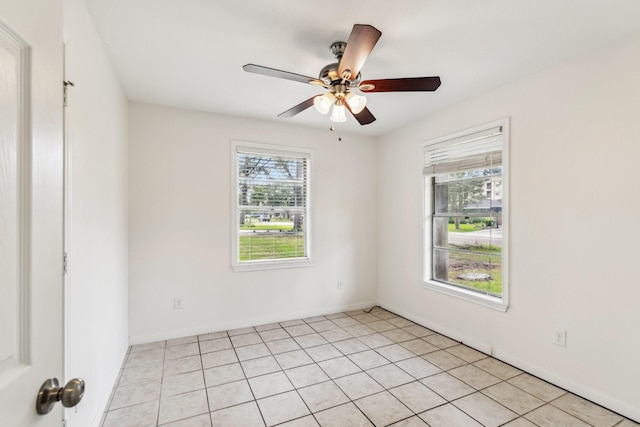 6038 Woodbrook Ln, Houston, TX 77008 - spare room featuring ceiling fan, baseboards, and light tile patterned flooring