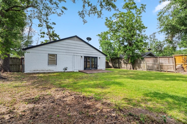 6038 Woodbrook Ln, Houston, TX 77008 - back of property featuring brick siding and a patio area