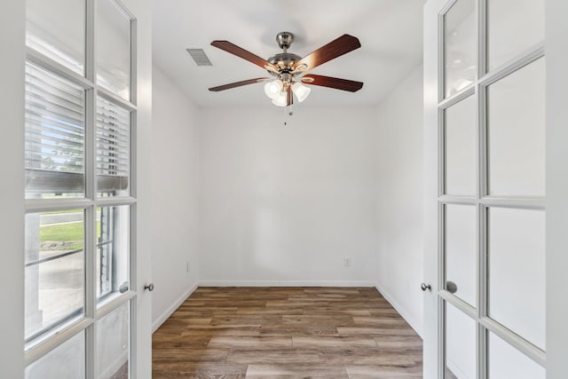 6038 Woodbrook Ln, Houston, TX 77008 - unfurnished room featuring ceiling fan, wood finished floors, and baseboards