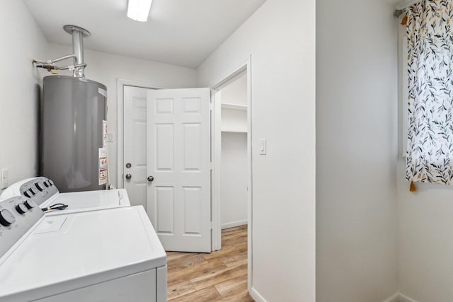 6038 Woodbrook Ln, Houston, TX 77008 - laundry area with water heater, separate washer and dryer, and light wood-style flooring