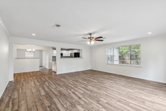6038 Woodbrook Ln, Houston, TX 77008 - unfurnished living room featuring a chandelier, light wood finished floors, ceiling fan, crown molding, and baseboards
