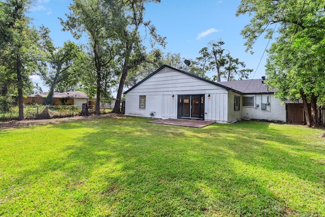 6038 Woodbrook Ln, Houston, TX 77008 - back of house featuring board and batten siding and a patio