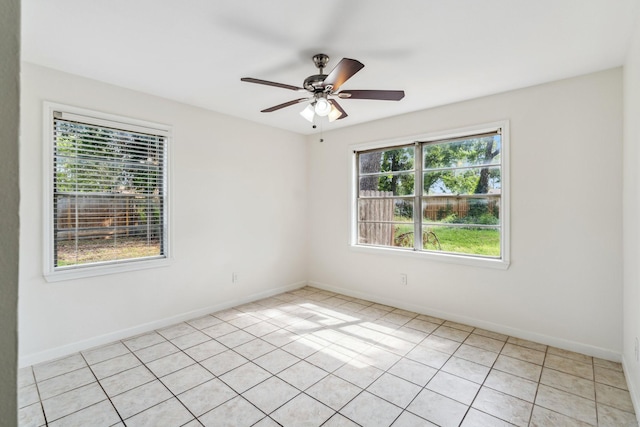 6038 Woodbrook Ln, Houston, TX 77008 - spare room featuring ceiling fan, baseboards, and light tile patterned floors