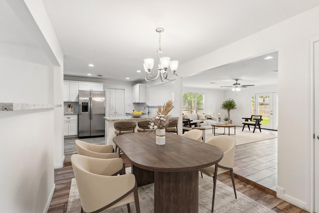 6038 Woodbrook Ln, Houston, TX 77008 - dining space featuring light wood-style flooring, recessed lighting, a chandelier, a ceiling fan, and baseboards