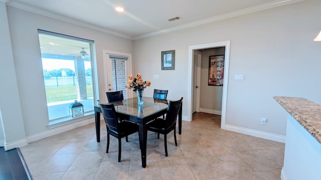 2530 Sparrow Crest Dr, Katy, TX 77494 - dining space with crown molding, baseboards, and light tile patterned floors