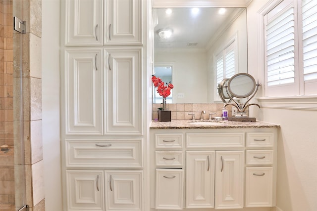 6235 Queenswood Ln, Houston, TX 77008 - bathroom with a shower stall, ornamental molding, and vanity