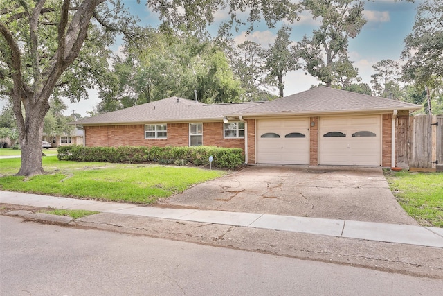6235 Queenswood Ln, Houston, TX 77008 - ranch-style house featuring a garage, concrete driveway, brick siding, and a shingled roof