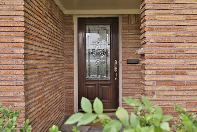 6235 Queenswood Ln, Houston, TX 77008 - doorway to property featuring brick siding