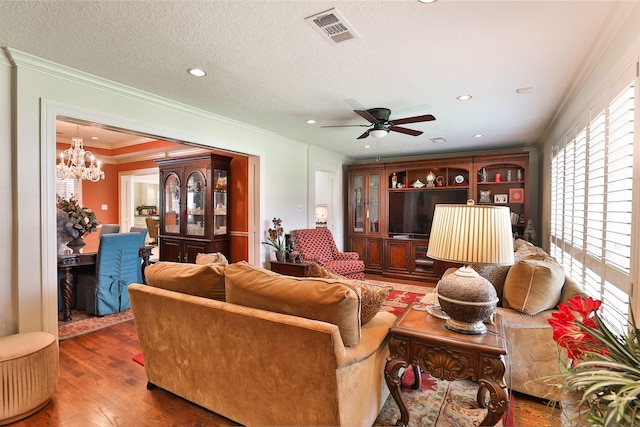 6235 Queenswood Ln, Houston, TX 77008 - living area featuring a chandelier, wood finished floors, crown molding, a ceiling fan, and recessed lighting