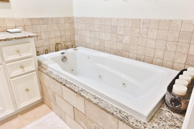 6235 Queenswood Ln, Houston, TX 77008 - full bathroom with a whirlpool tub, a textured wall, tile walls, and tile patterned floors
