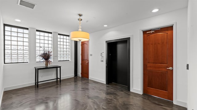 2323 Polk St Unit 302, Houston, TX 77003 - spare room featuring concrete floors, baseboards, recessed lighting, and elevator