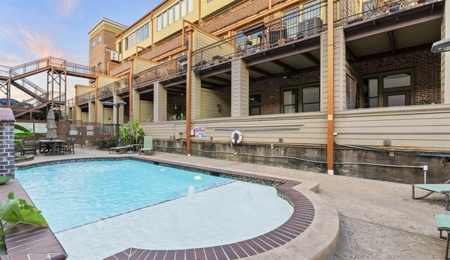 2323 Polk St Unit 302, Houston, TX 77003 - view of pool featuring a patio