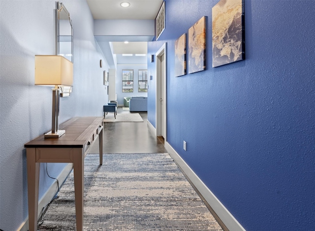2323 Polk St Unit 302, Houston, TX 77003 - hallway with a textured wall and baseboards