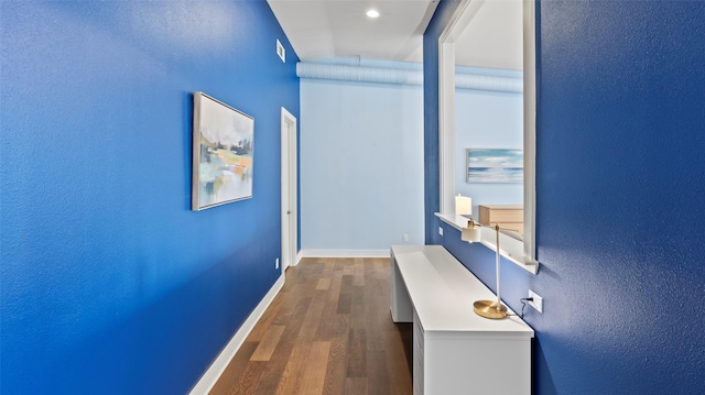 2323 Polk St Unit 302, Houston, TX 77003 - hall with dark wood-type flooring and baseboards