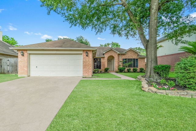 31115 Perlican Dr, Spring, TX 77386 - ranch-style home with driveway, brick siding, an attached garage, and roof with shingles