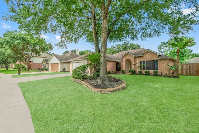 31115 Perlican Dr, Spring, TX 77386 - ranch-style house with brick siding, driveway, and a garage