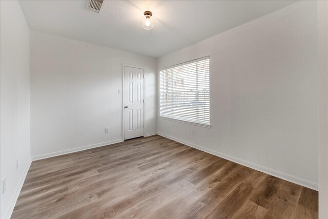 31115 Perlican Dr, Spring, TX 77386 - spare room featuring baseboards and wood finished floors