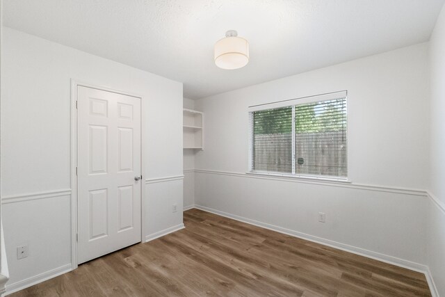31115 Perlican Dr, Spring, TX 77386 - unfurnished bedroom featuring wood finished floors and baseboards