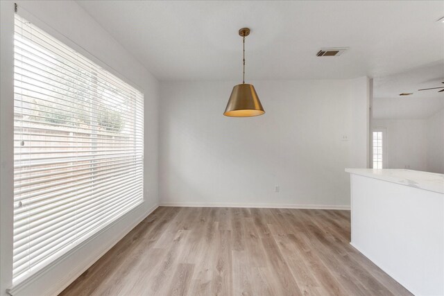 31115 Perlican Dr, Spring, TX 77386 - unfurnished dining area featuring light wood-type flooring, baseboards, and ceiling fan