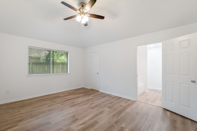 31115 Perlican Dr, Spring, TX 77386 - unfurnished room with light wood finished floors, ceiling fan, baseboards, and lofted ceiling