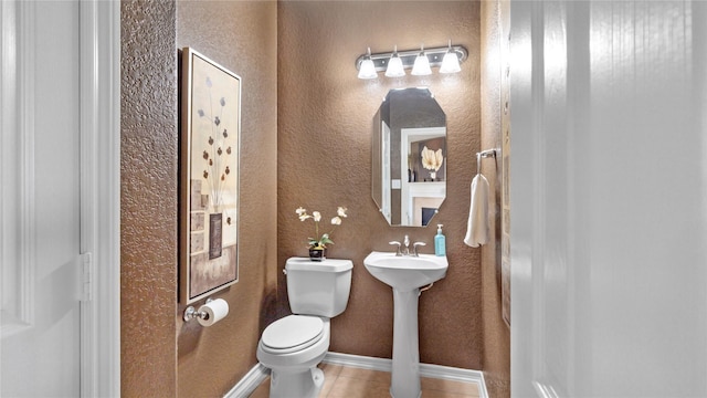 13703 View Meadow Ln, Houston, TX 77034 - half bathroom featuring toilet, tile patterned flooring, baseboards, and a textured wall