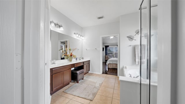 13703 View Meadow Ln, Houston, TX 77034 - bathroom featuring tile patterned flooring, vanity, connected bathroom, a shower stall, and a garden tub