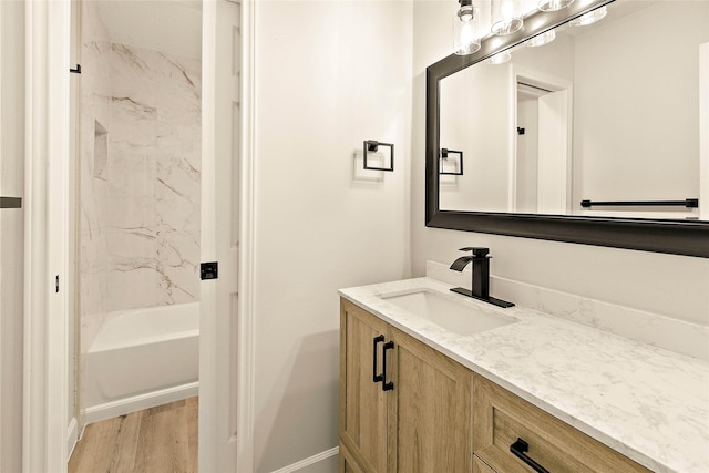 50 E Copper Sage Cir, The Woodlands, TX 77381 - full bathroom featuring vanity, baseboards, wood finished floors, and shower / bath combination