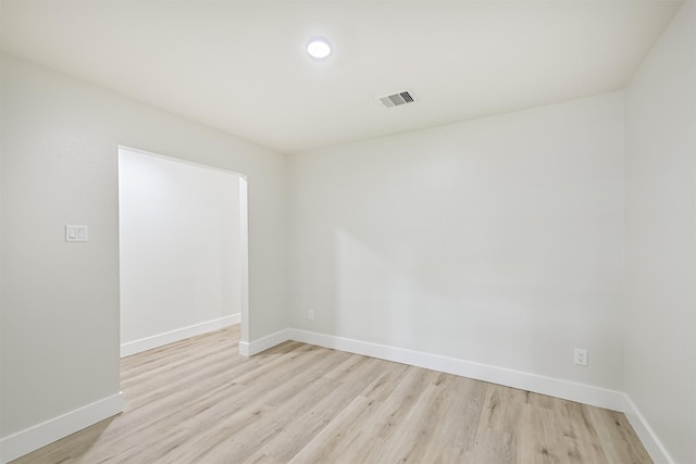1210 E Rutgers Ln, Deer Park, TX 77536 - unfurnished room featuring baseboards and light wood-style flooring