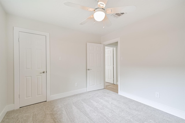 1210 E Rutgers Ln, Deer Park, TX 77536 - unfurnished bedroom featuring carpet, baseboards, and a ceiling fan