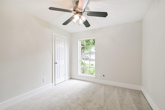 1210 E Rutgers Ln, Deer Park, TX 77536 - carpeted empty room featuring baseboards and ceiling fan