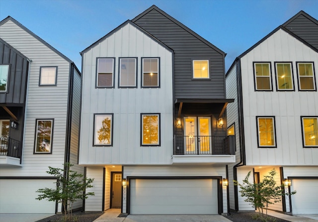807 Martin St Unit D, Houston, TX 77018 - view of front of property featuring an attached garage, board and batten siding, and concrete driveway