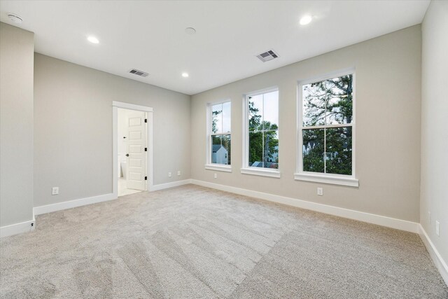 807 Martin St Unit D, Houston, TX 77018 - empty room with baseboards, light colored carpet, recessed lighting, and a smoke detector