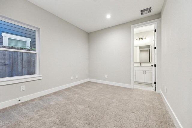 807 Martin St Unit D, Houston, TX 77018 - carpeted spare room featuring baseboards and recessed lighting