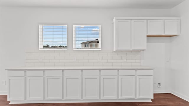 14304 Sweet Meadow Trl, Conroe, TX 77384 - detailed view of tasteful backsplash, baseboards, and wood finished floors