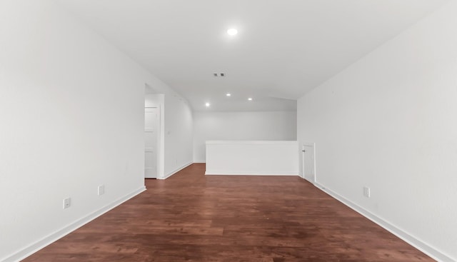 14304 Sweet Meadow Trl, Conroe, TX 77384 - spare room with recessed lighting, dark wood-style floors, baseboards, and vaulted ceiling