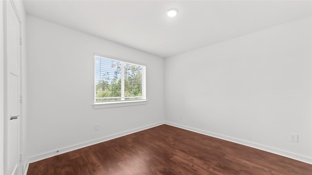14304 Sweet Meadow Trl, Conroe, TX 77384 - empty room featuring dark wood-style floors and baseboards