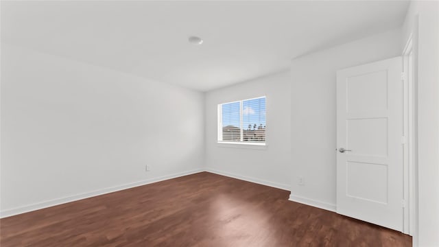 14304 Sweet Meadow Trl, Conroe, TX 77384 - empty room featuring dark wood-type flooring and baseboards