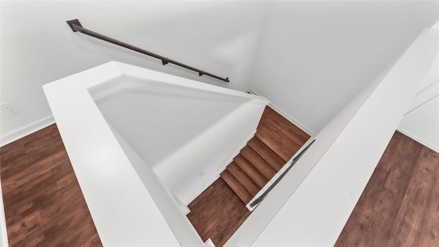 14304 Sweet Meadow Trl, Conroe, TX 77384 - stairway featuring baseboards and wood finished floors