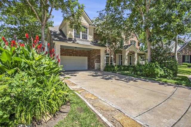 2839 Taylorcrest, Missouri City, TX 77459 - traditional home with a garage, stone siding, brick siding, and concrete driveway