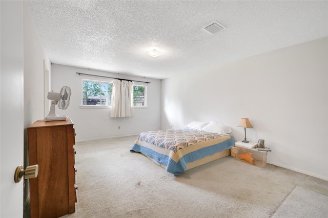 10722 Glenway Dr, Houston, TX 77070 - bedroom with carpet, a textured ceiling, and baseboards