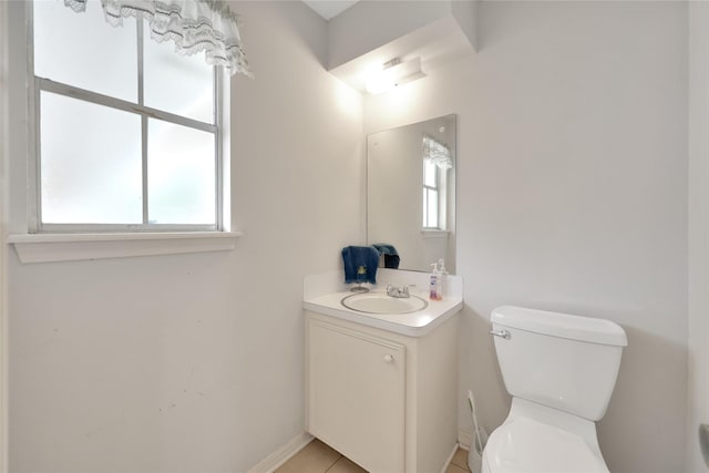 10722 Glenway Dr, Houston, TX 77070 - half bath featuring vanity, toilet, plenty of natural light, and baseboards