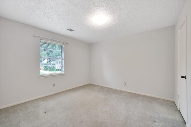 10722 Glenway Dr, Houston, TX 77070 - spare room with light carpet, a textured ceiling, and baseboards