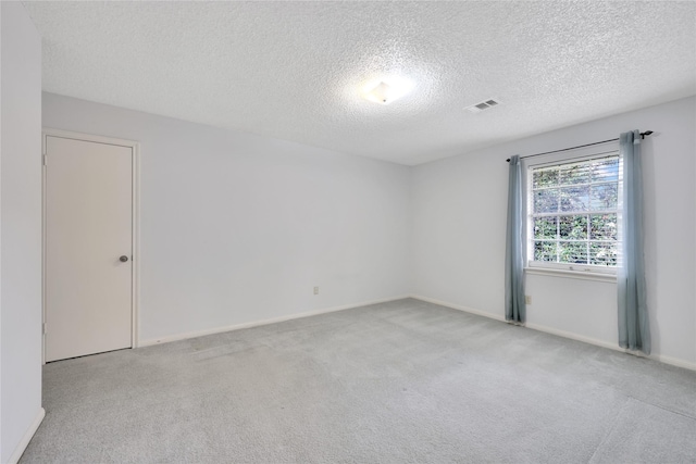 10722 Glenway Dr, Houston, TX 77070 - empty room with a textured ceiling, carpet, and baseboards
