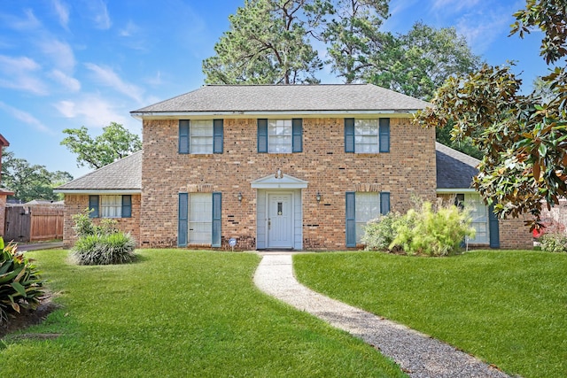10722 Glenway Dr, Houston, TX 77070 - colonial inspired home with a shingled roof and brick siding