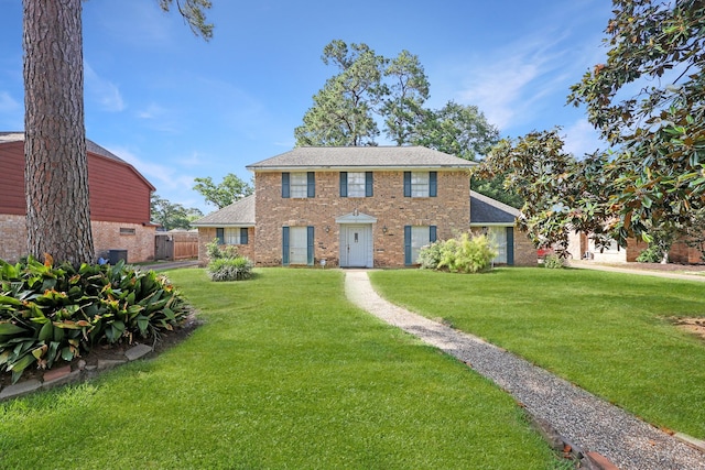 10722 Glenway Dr, Houston, TX 77070 - colonial home featuring brick siding and roof with shingles