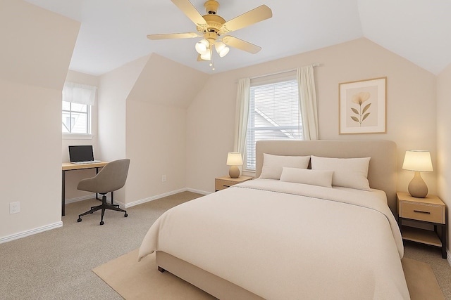 615 Columbus St, College Station, TX 77840 - carpeted bedroom with vaulted ceiling, multiple windows, a desk, and baseboards