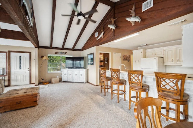 215 Selkirk Rd, Matagorda, TX 77414 - dining area featuring ceiling fan, light carpet, and baseboards
