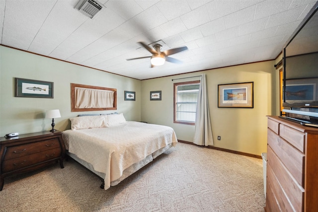 215 Selkirk Rd, Matagorda, TX 77414 - bedroom with light colored carpet, baseboards, a ceiling fan, and crown molding